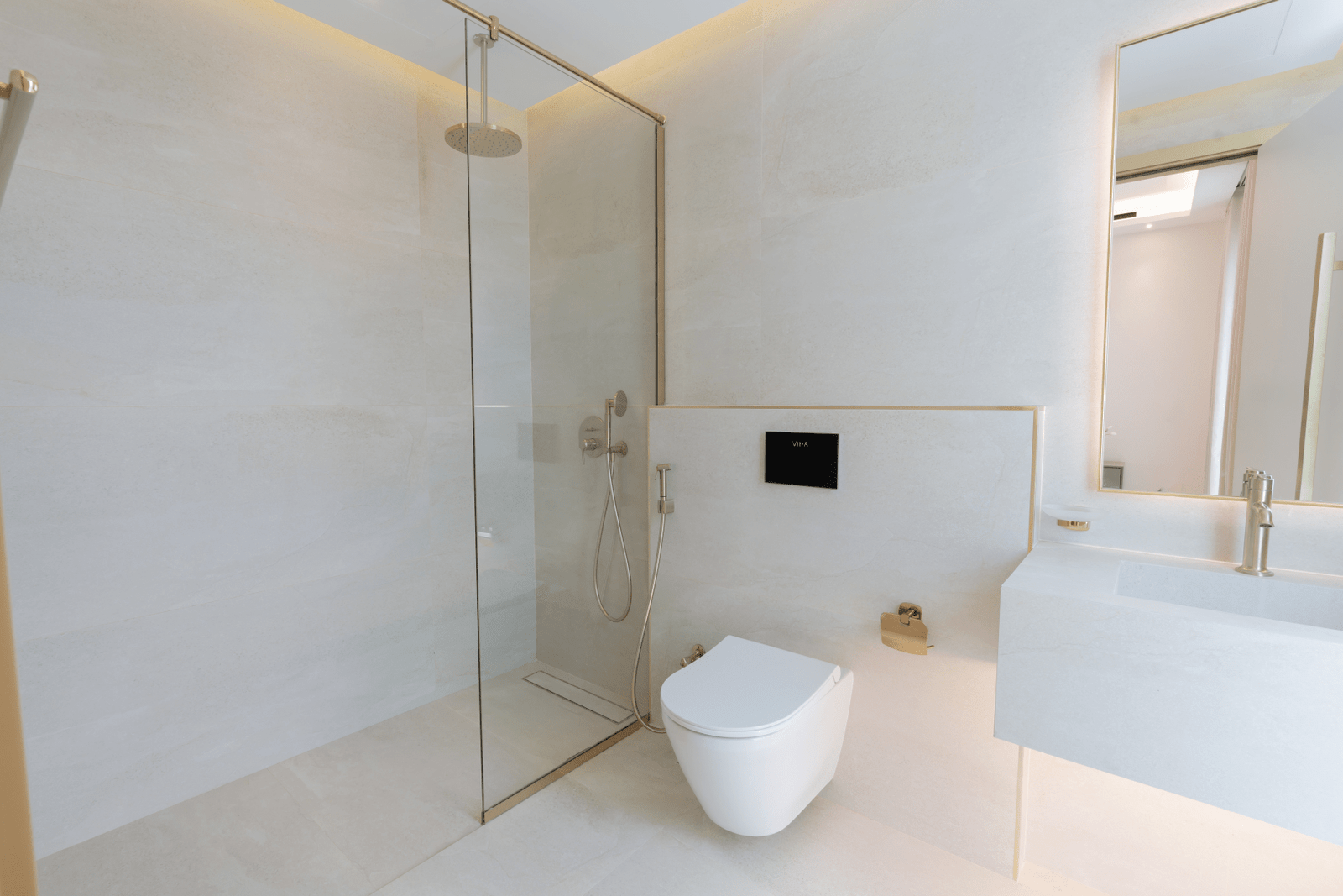 Close-up of the shower area with sleek fittings and frosted glass.